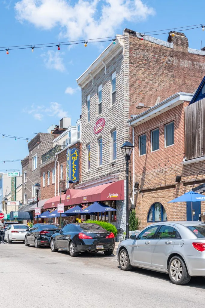 view of little italy baltimore with lights strewn across the street