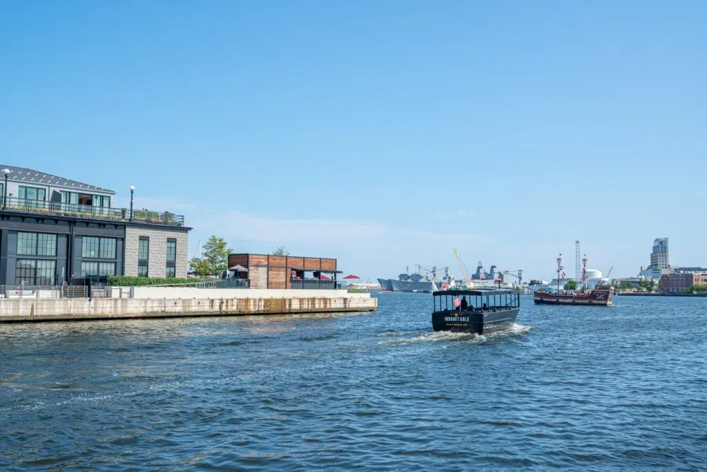 small boats heading out into the water in baltimore maryland