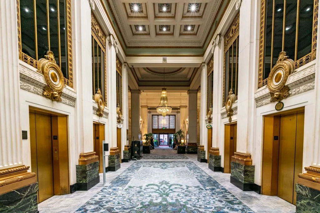 bank of gold elevators in historic kimpton monaco hotel baltimore, one of the best places to stay during a long weekend in baltimore maryland