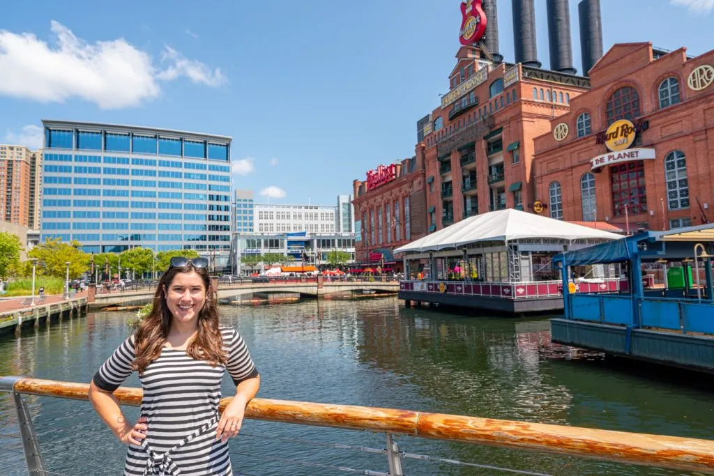 kate storm in a striped dress sightseeing in baltimore inner harbor