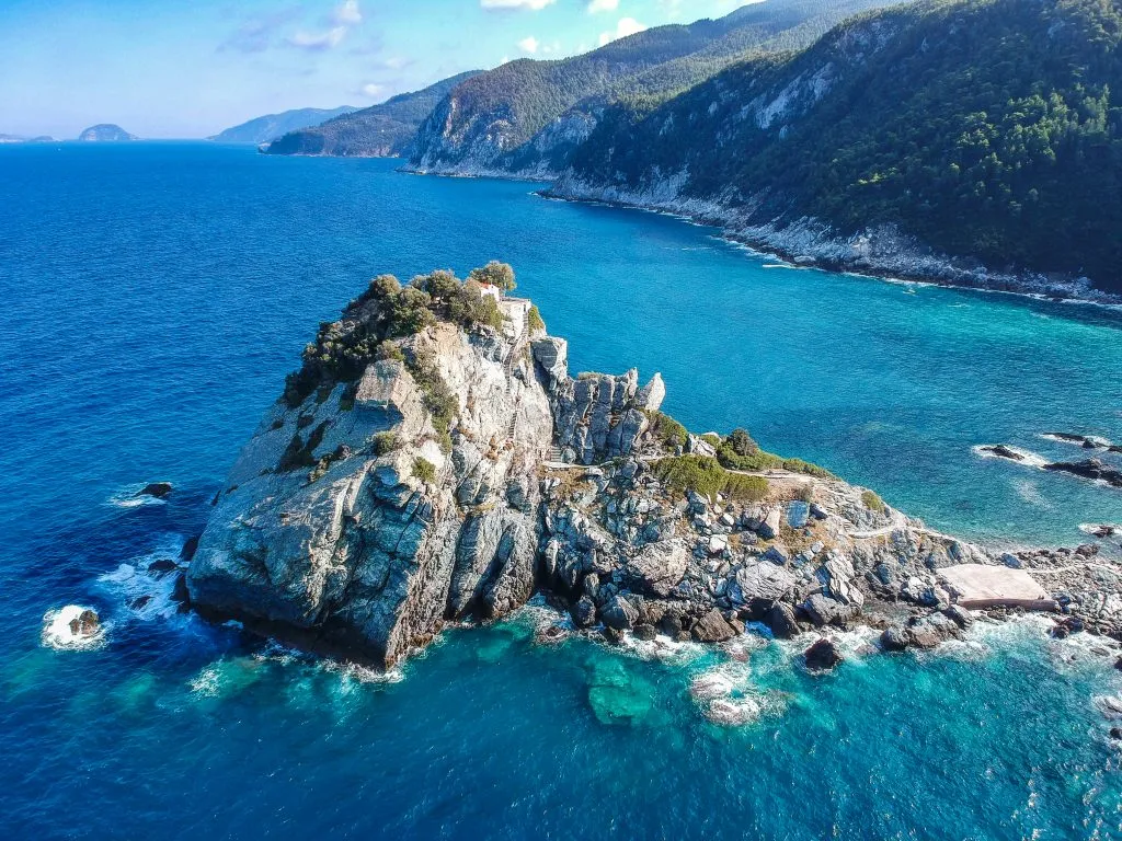 aerial view of mamma mia church in skopelos greece, one of the best places to visit with a 7 day greece itinerary