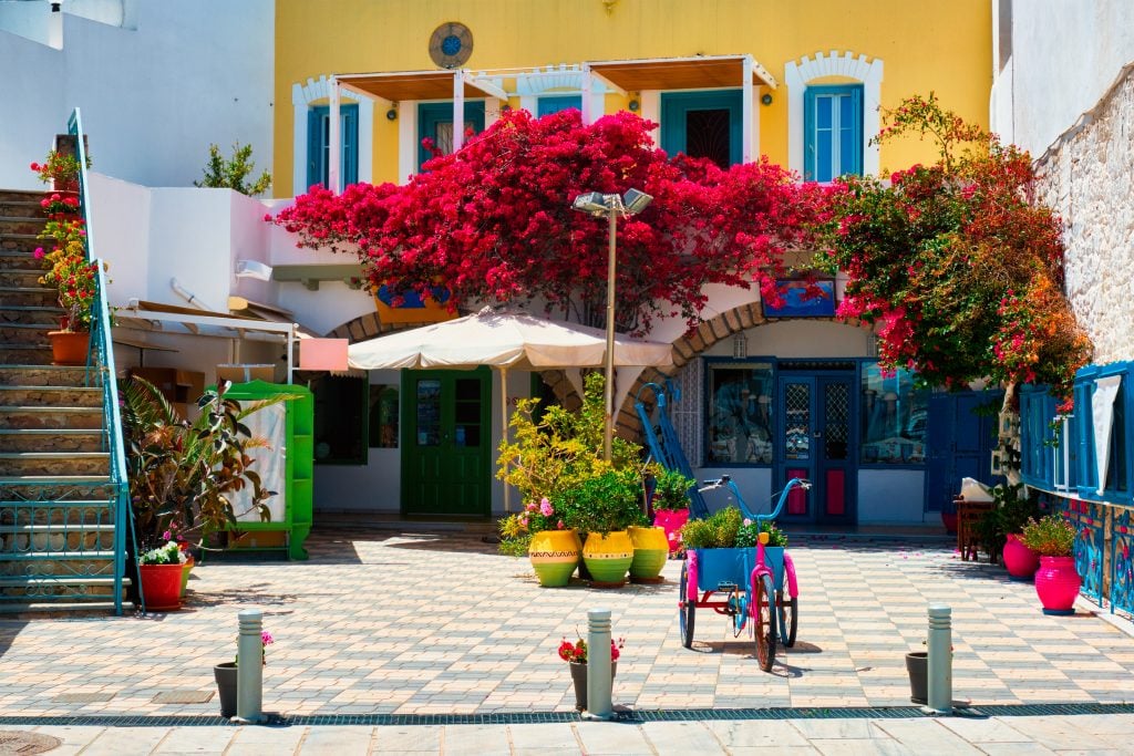 colorful yellow building in adamas greece