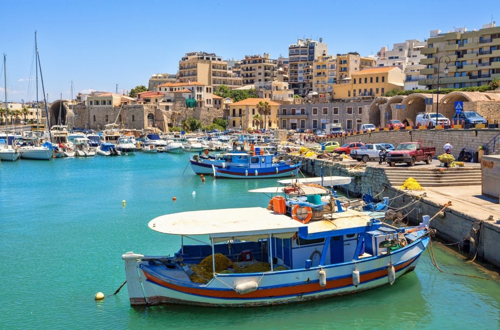 harbor of heraklion greece with city in the background, a fun place to visit during a week in greece crete