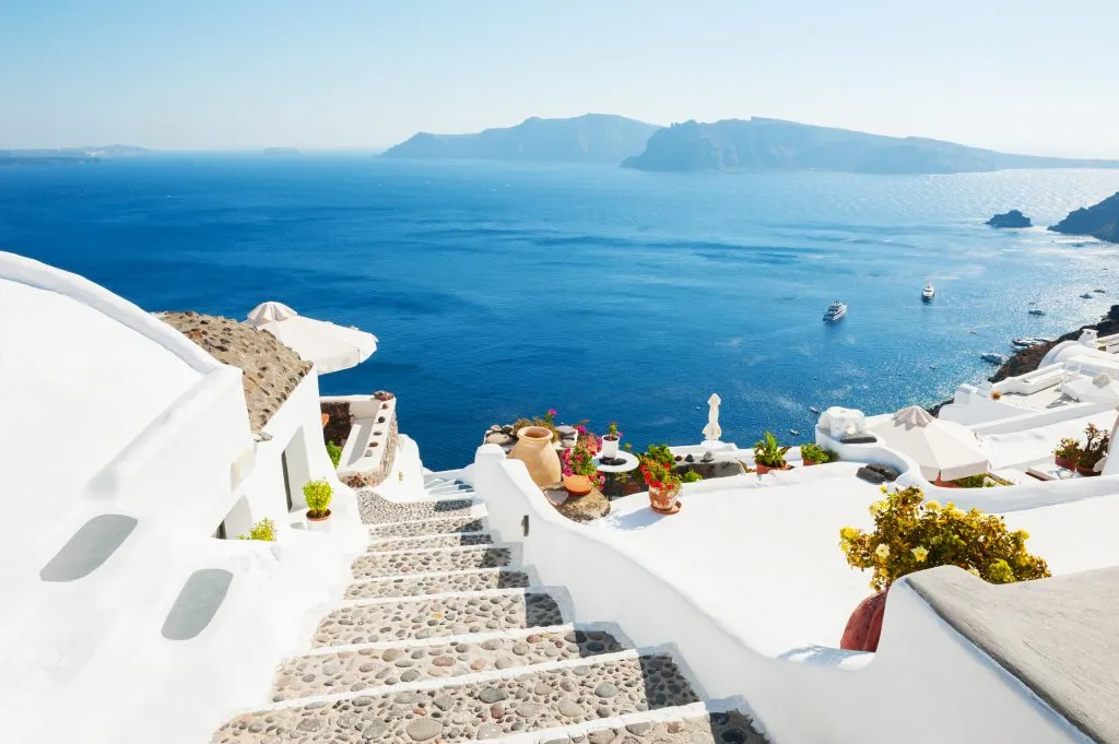 white stairs leading toward the sea santorini