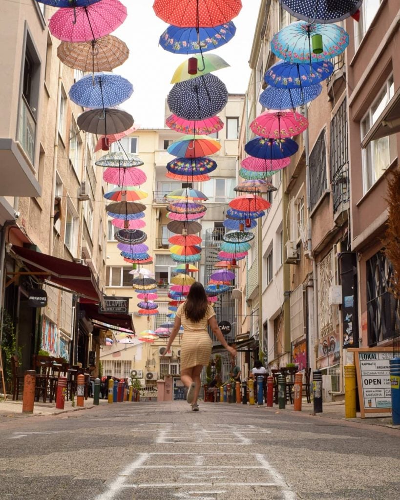 kate storm with a colorful umbrella ceiling in istanbul turkey