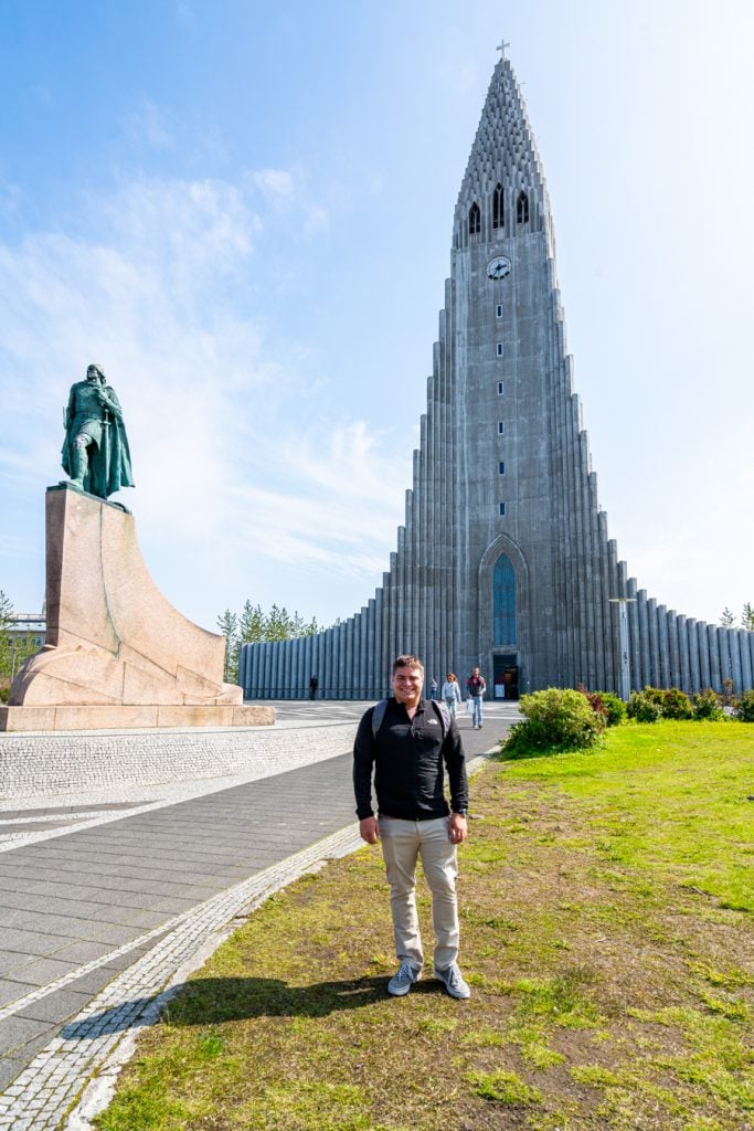 jeremy storm standing in front of reykjavik church