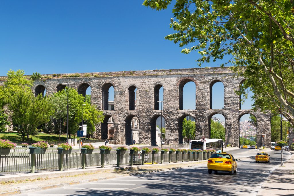 valens aqueduct in istanbul turkey with a taxi in the foreground