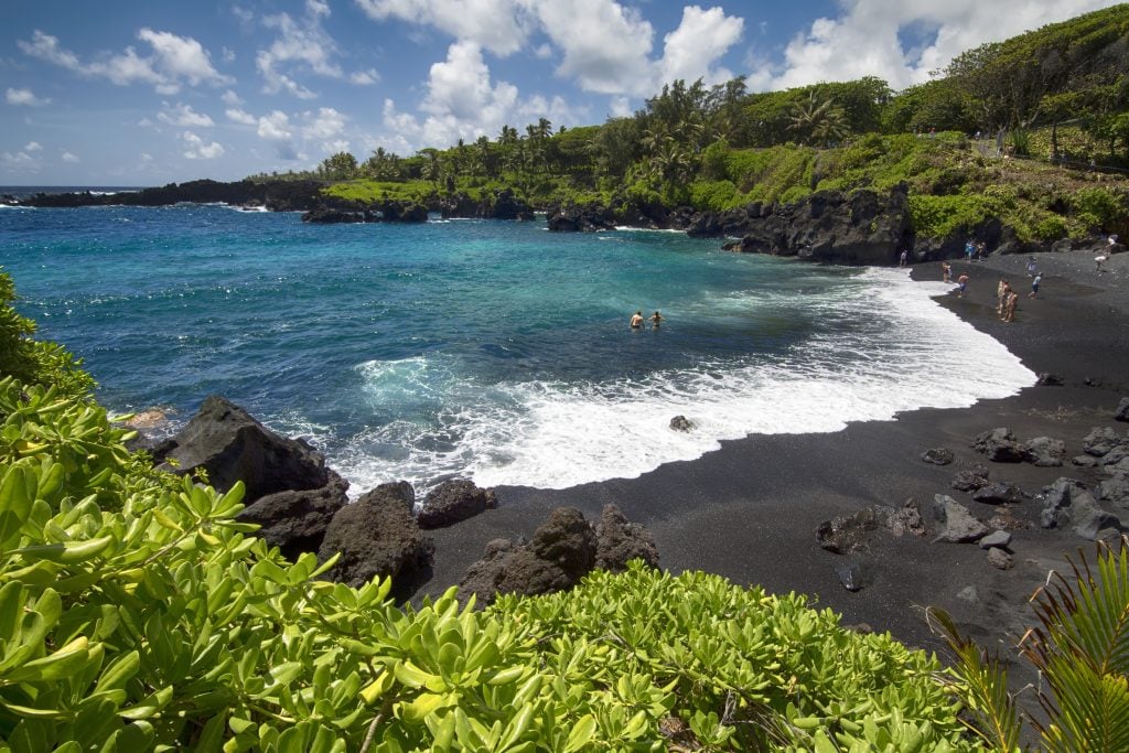 black sand beach in Waianapanapa state park on road to hana maui, one of the best things to do in usa