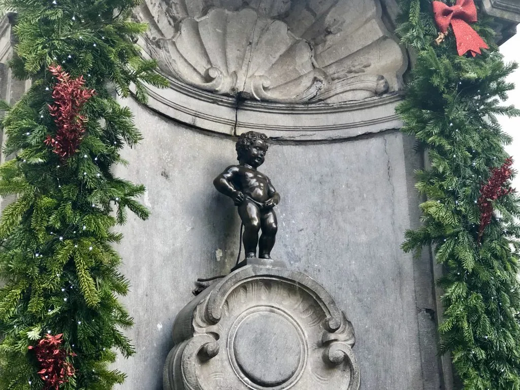 mannekin pis brussels belgium with christmas decorations in belgium in december