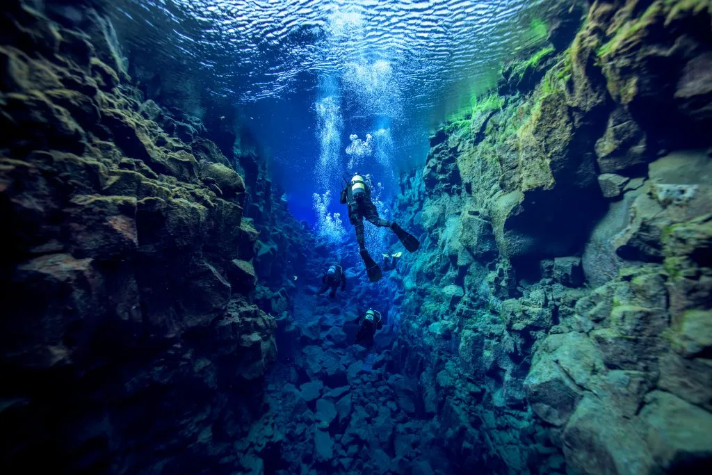 person scuba diving silfra thingvellir national park