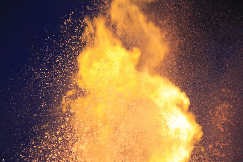 flames being thrown from the mirage volcano in las vegas at night