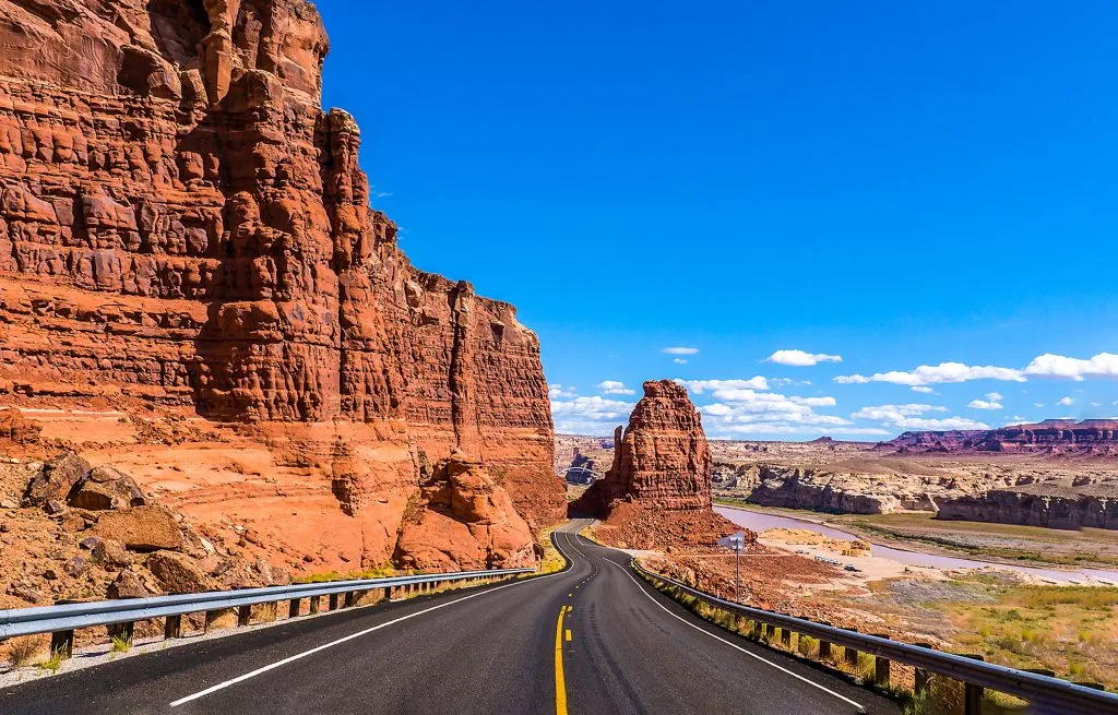 beautiful road surrounded by red rock formations in red rock canyon nevada