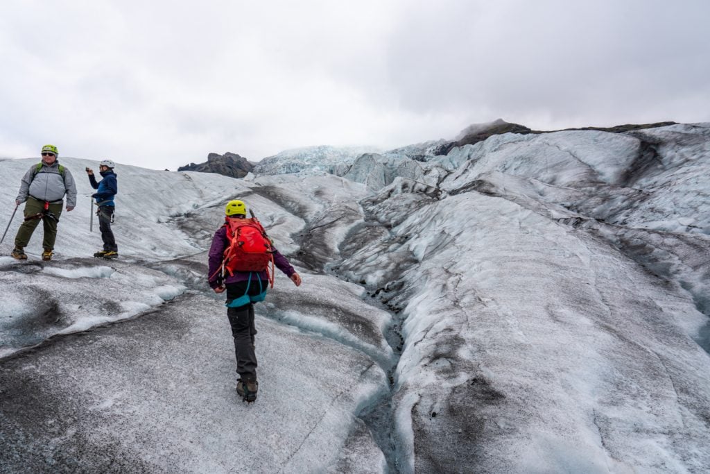 iceland glacier tour group walking up the ice
