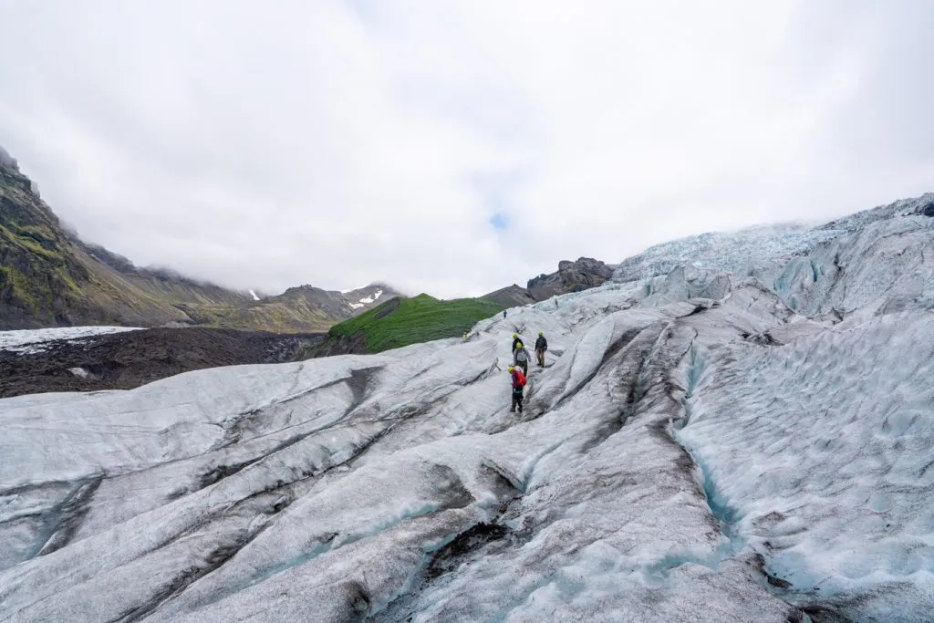 iceland glacier tour group in the distance as seen when hiking on vatnajokull