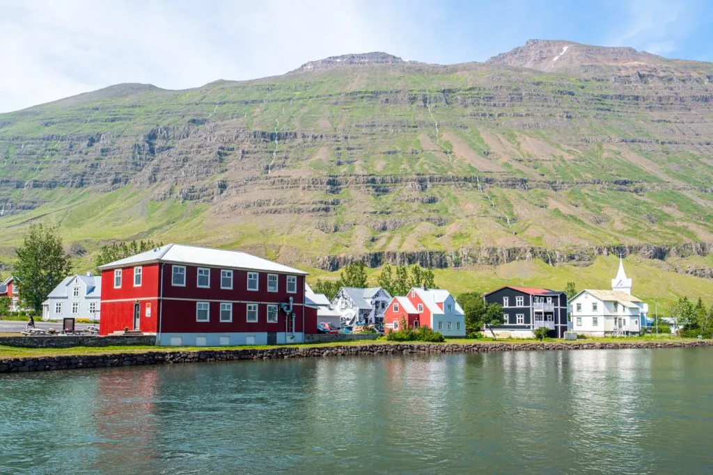 wooden buildings with water in the foreground seydisfjordur iceland