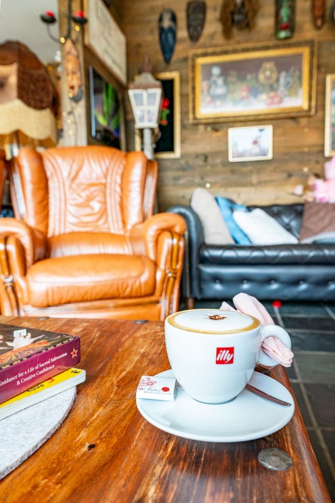 cozy coffee shop in iceland with leather chair, perfect for reading iceland books