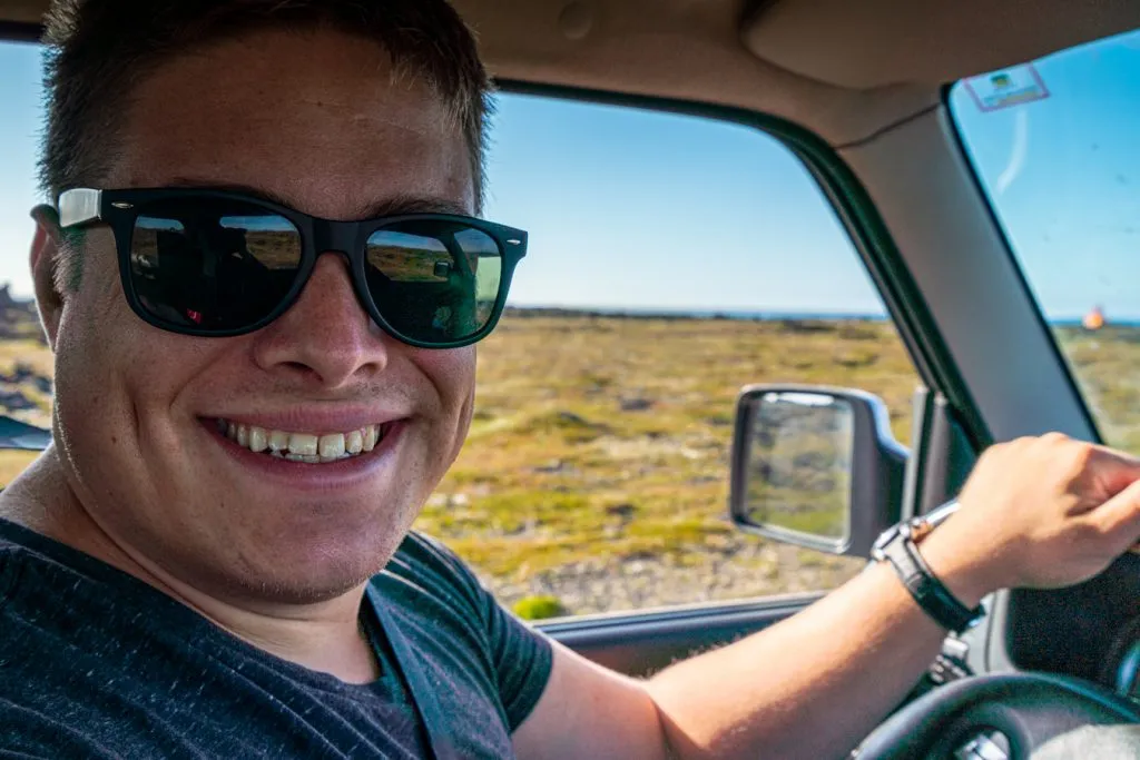 jeremy storm behind the wheel of a rental car iceland