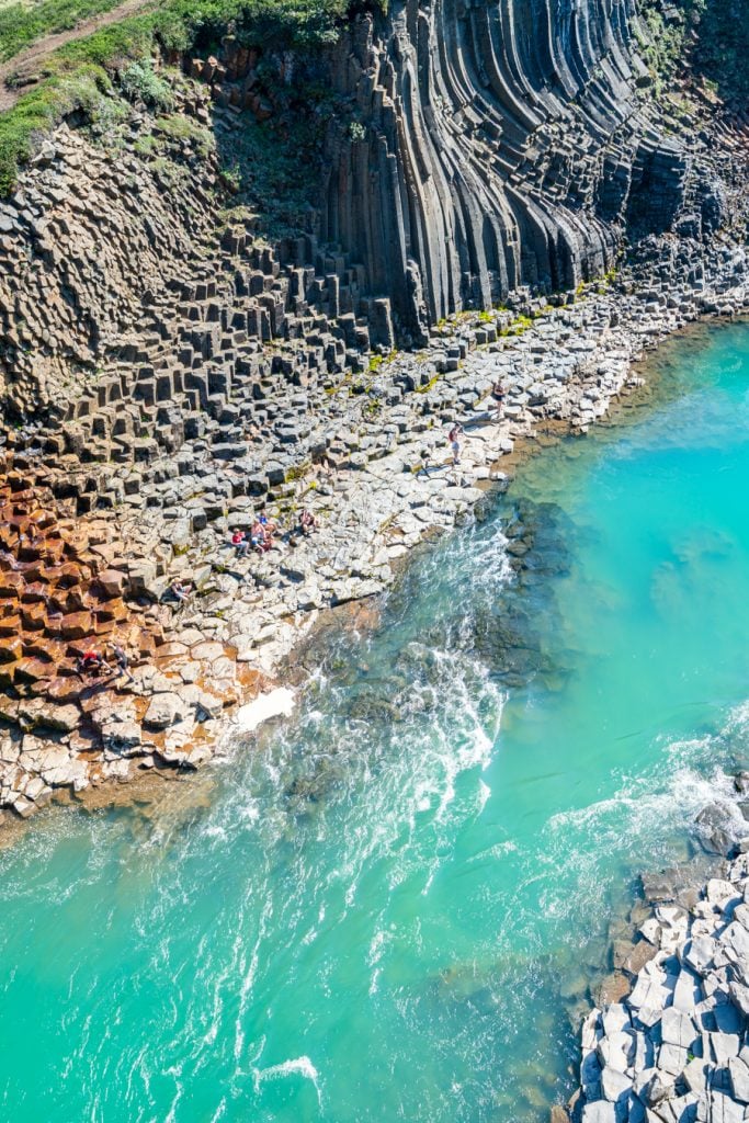 bright turquoise water of stuthlagil canyon iceland from above