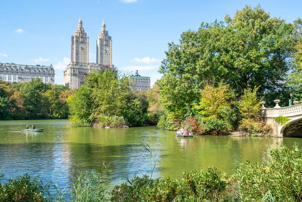 view of central park rowboats with a small piece of bow bridge visible on the right in central park nyc