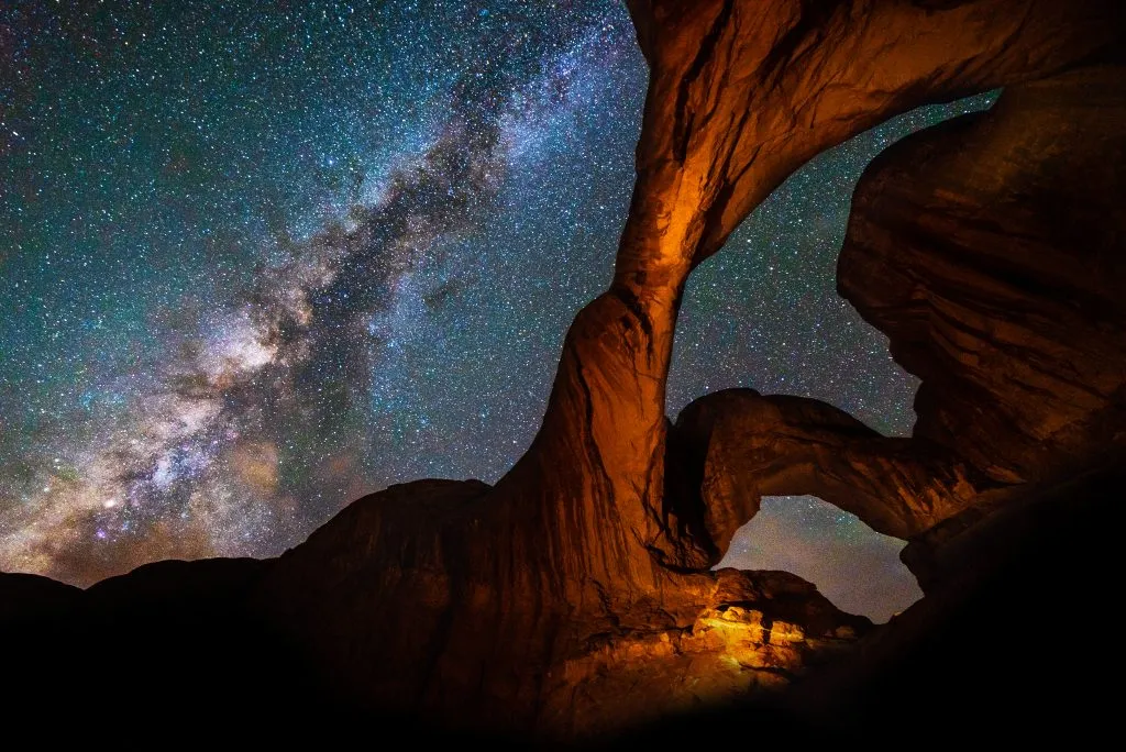 view of milky way stargazing in arches national park at double arch