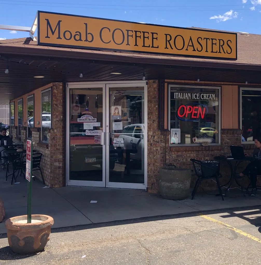 front facade of moab coffee shop with yellow sign