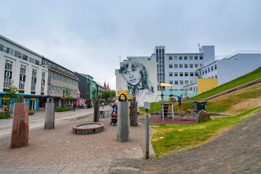 downtown akureyri with large mural in the foreground