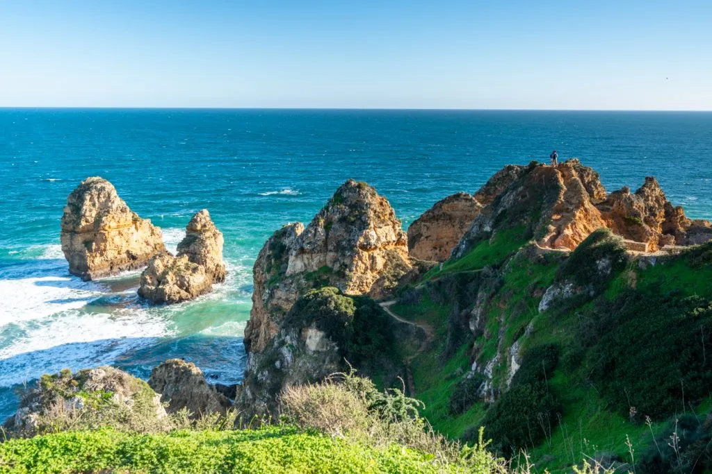 view of rock formations along the coast at ponta da piedade, one of the best things to see in lagos