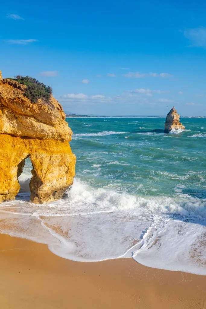 rock formations with an arch on praia do camilo, one of the best activities in lagos portugal