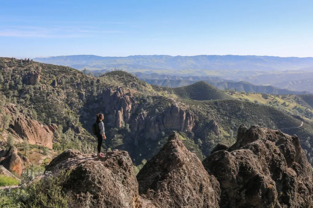 view of a hiker on high peaks trail pinnacles national park, one of the most off the beaten path usa vacation destinations