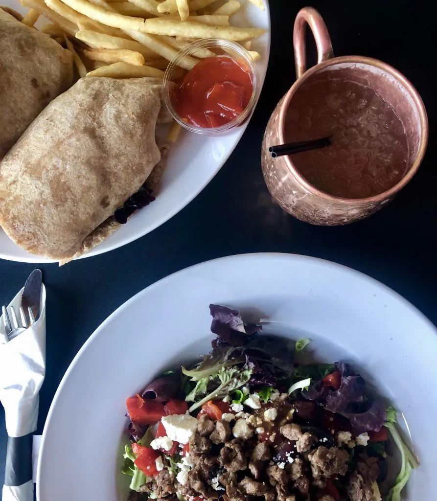 steak salad and sandwich served at outdoor dining moab restaurants glorias