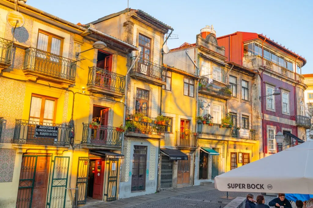 colorful buildings in porto portugal illuminated by a sunset