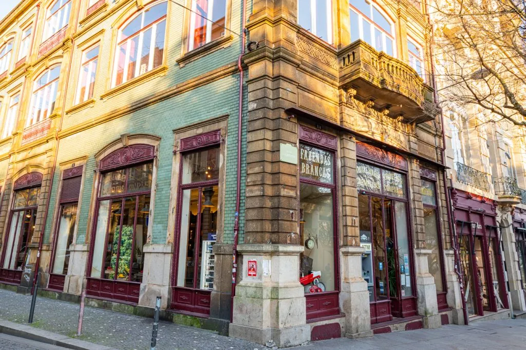 picturesque green storefront in porto portugal