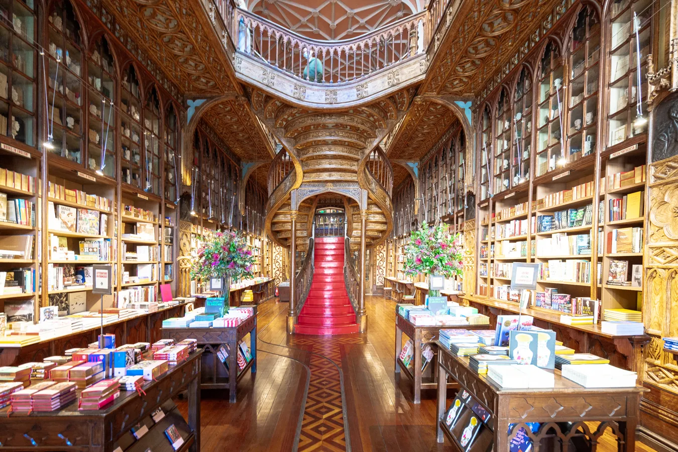livraria lello porto portugal famous bookstore with red staircase in center