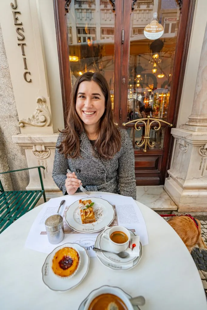 kate storm with a collection of pastries at majestic cafe -- ordering in cafes is a great reason to study portuguese when planning a trip to portugal