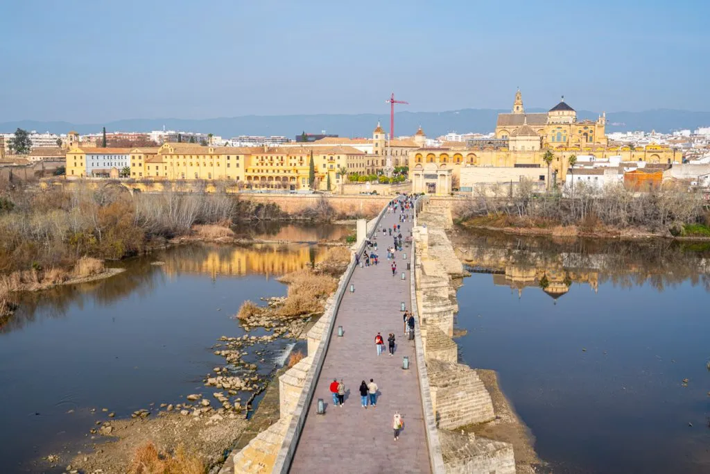 view of cordoba spain and roman bridge from calahorra tower, one of the best things to do in cordoba spain