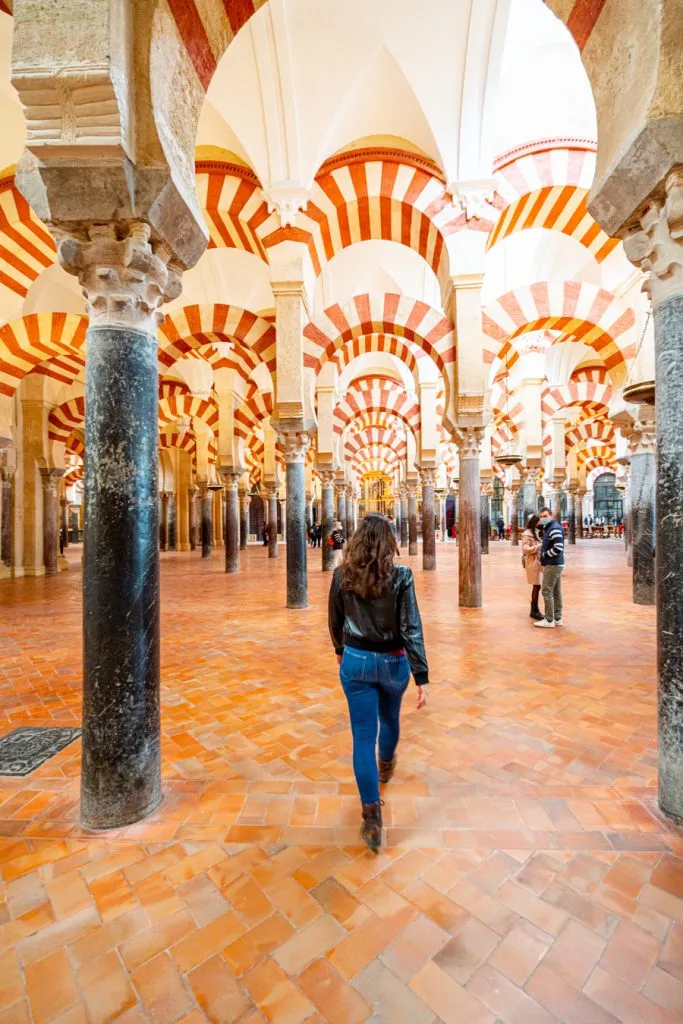 kate storm underneath arches of cordoba mosque cathedral, top attractions in cordoba spain