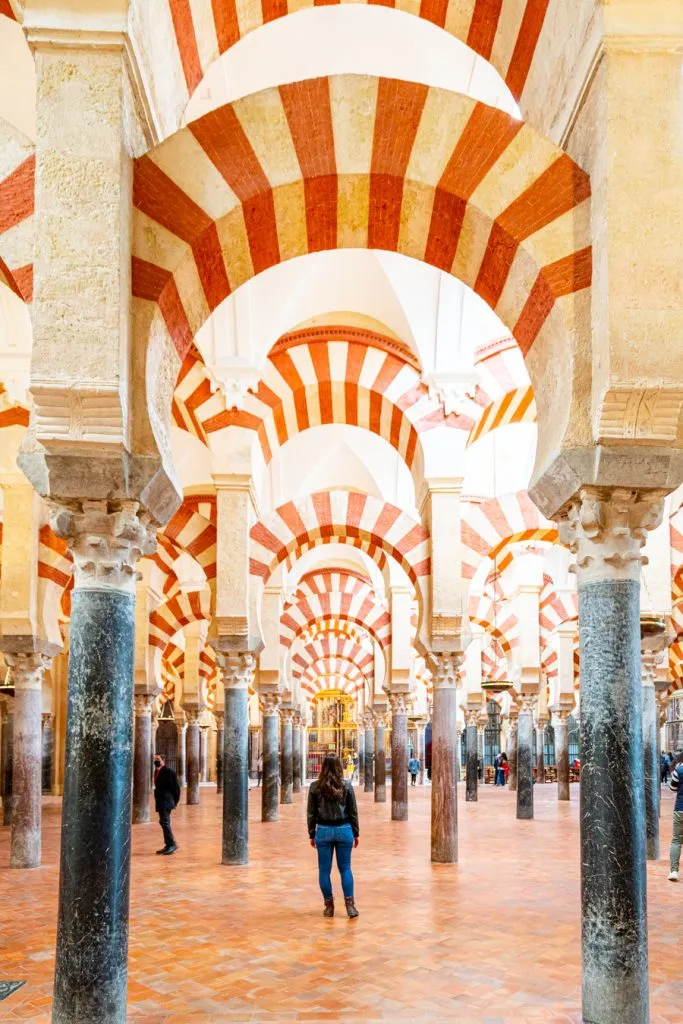 kate storm underneath arches of cordoba mosque cathedral, top attractions in cordoba spain