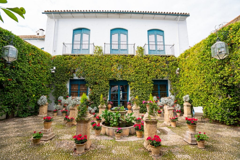 colorful patio with fountain in palacio de la viana