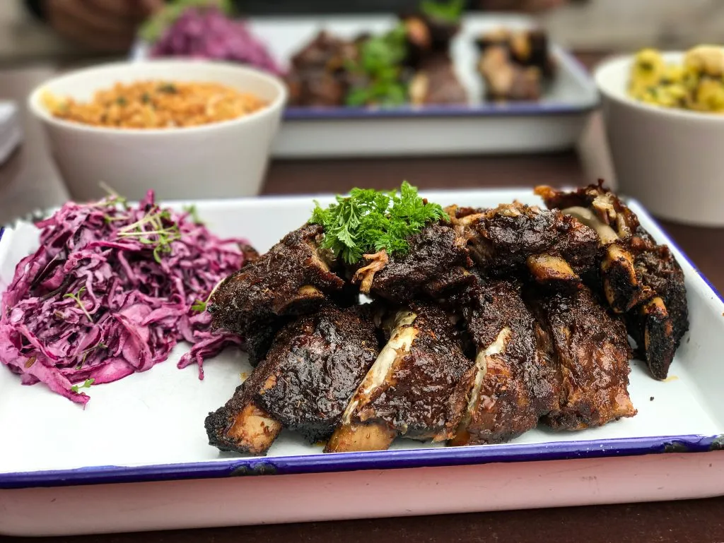 ribs and coleslaw served at an upscale food market