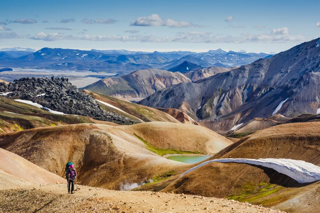 person hiking in mountainous landscape Landmannalaugar iceland travel destination