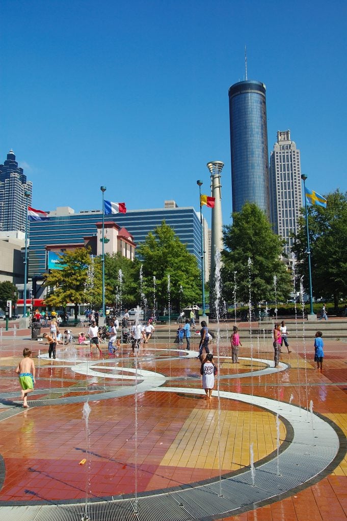 children playing in the fountain of a summer weekend in atlanta georgia centennial park