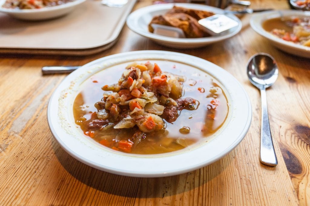 two bowls of soup set out on a wood table in reykjavik iceland