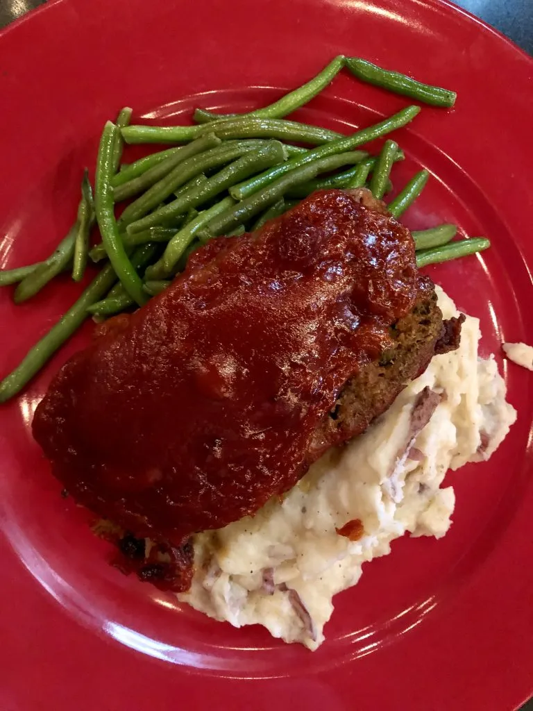 meatloaf on a red plate from amos mosquitos restaurant atlantic beach north carolina