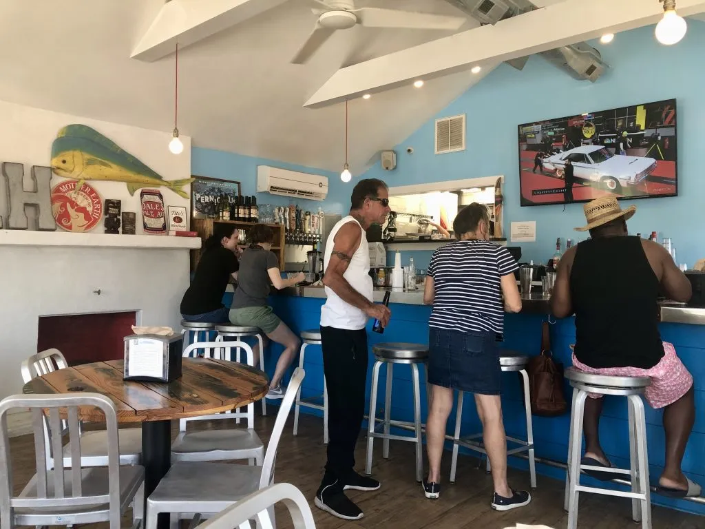 travelers gathered at the bar in idle house biergarten atlantic beach nc