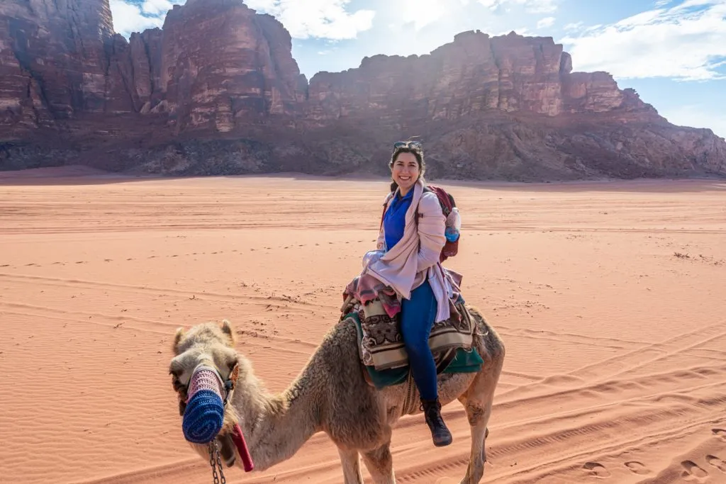 kate storm riding a camel wadi rum jordan