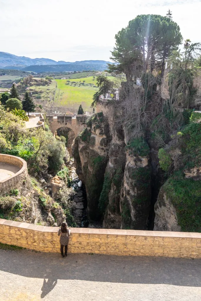 kate storm overlooking the cuenca gardens in ronda spain road trip andalucia