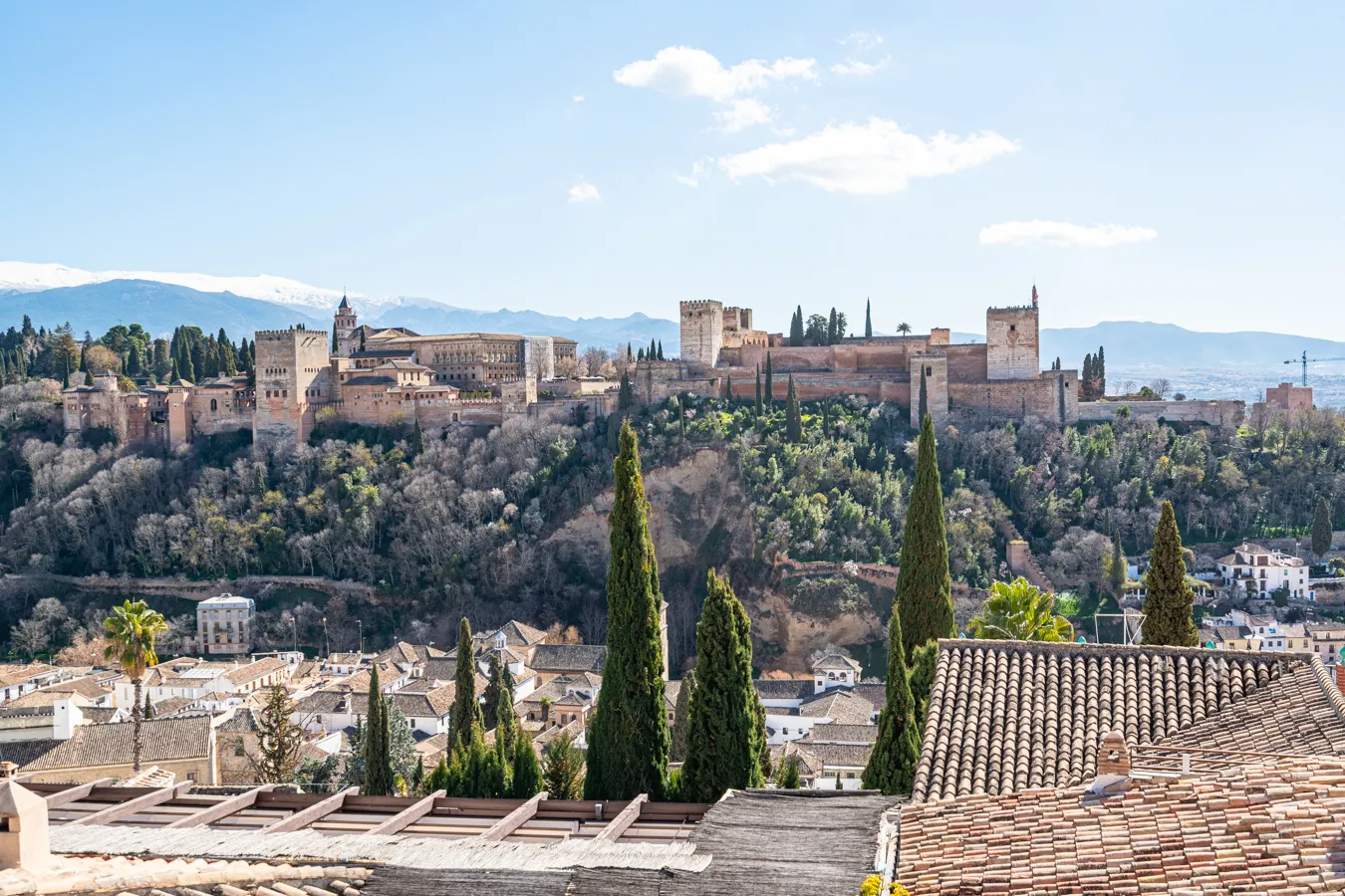 view of alhambra from mirador san nicholas, one of the top attractions on an andalucia road trip itinerary