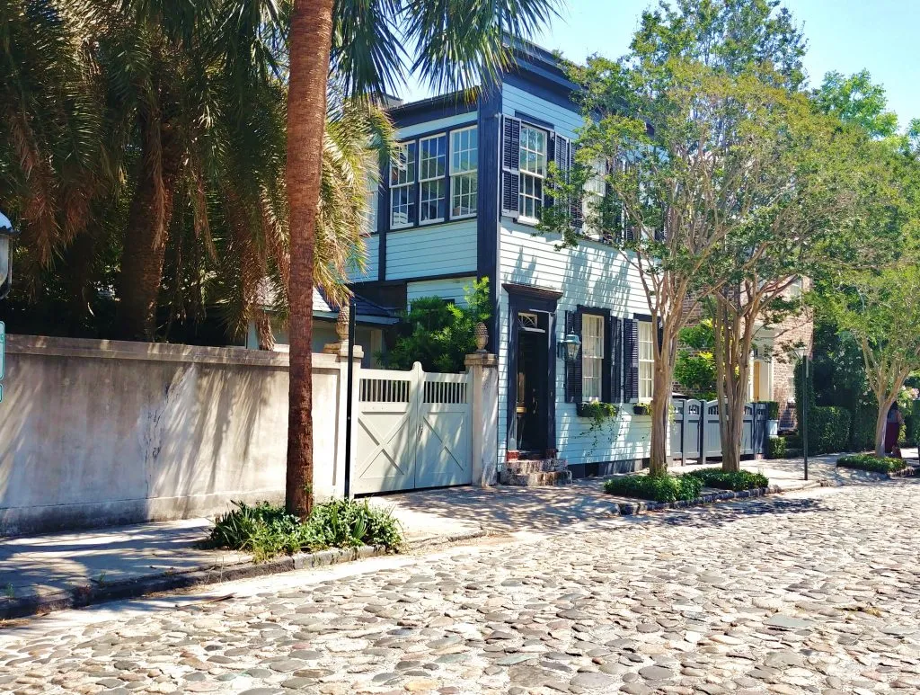 colonial houses on chalmers street charleston sc with cobblestones in the foreground