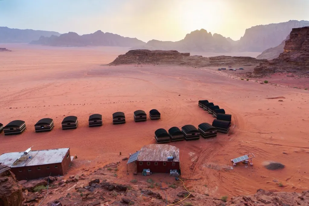wadi rum camping tents as seen drom above at sunset