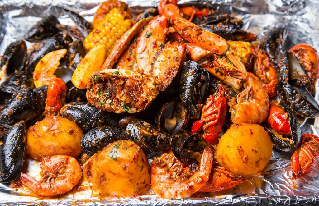 seasoned seafood boil including crab legs and mussels